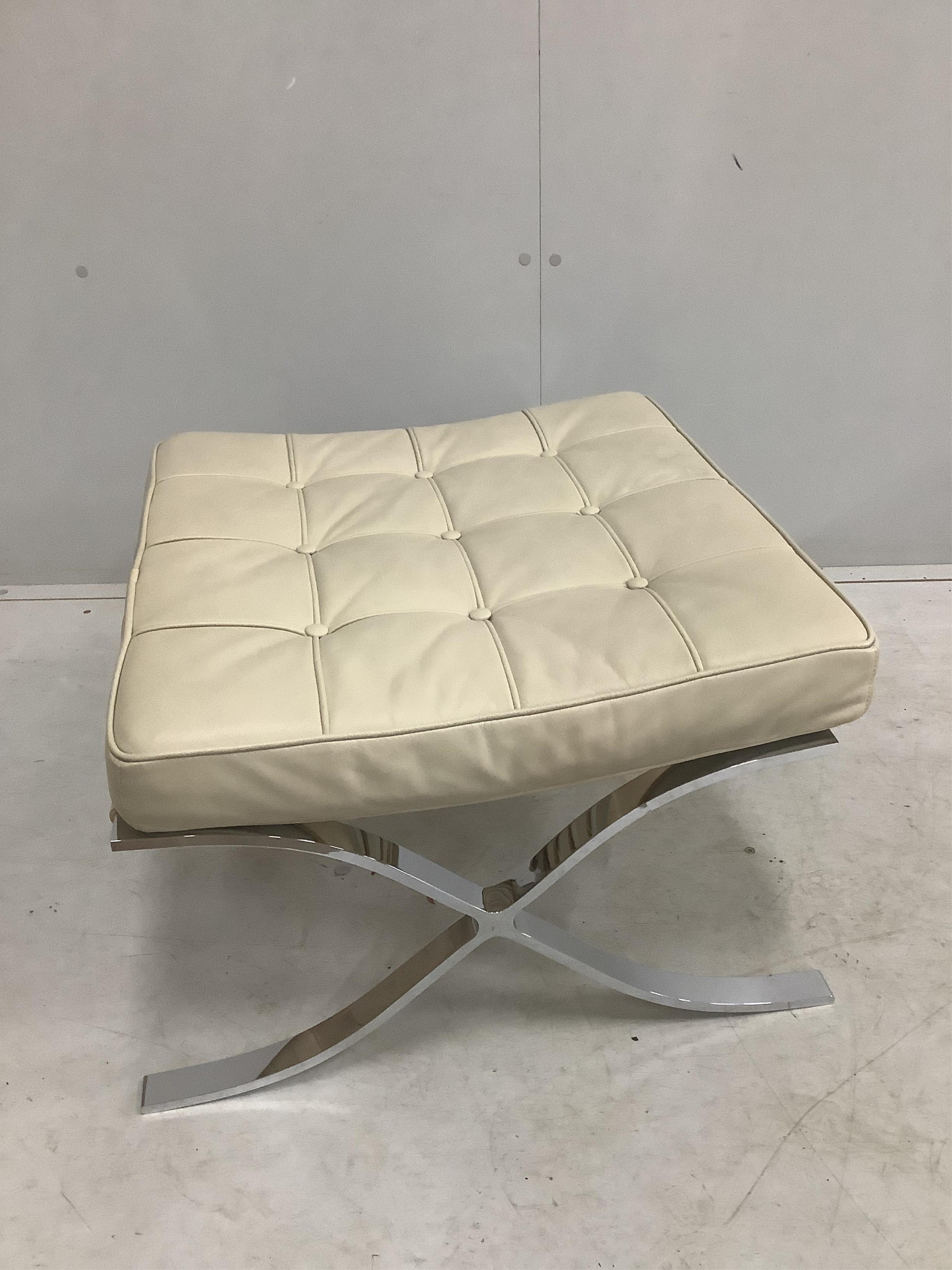 A pair of Barcelona style ivory leather and chrome ottoman stools, width 61cm, depth 58cm, height 36cm. Condition - good